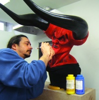 David Pea puts the finishing touches on the “Darkness” Mask Dragon Skin with Psycho Paint The mask has a FlexFoam-It™ 5 core. Horns cast in Task™ plastic shell filled with rigid Foam-It™ 3.